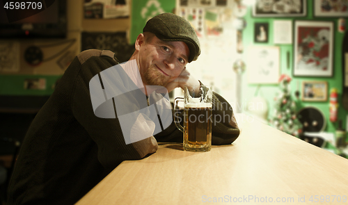 Image of Guy with beer in the bar