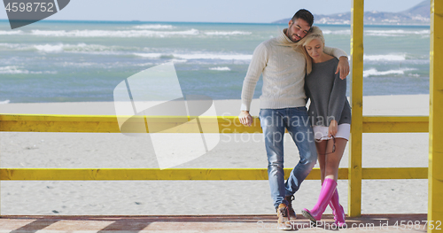 Image of Couple chating and having fun at beach bar