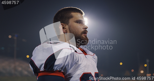 Image of portrait of young confident American football player