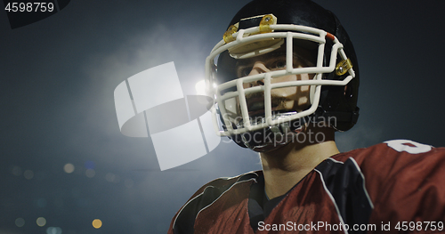 Image of portrait of young confident American football player