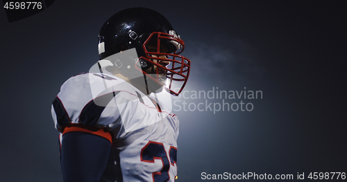 Image of portrait of young confident American football player