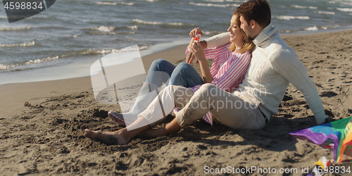 Image of Couple enjoying time together at beach