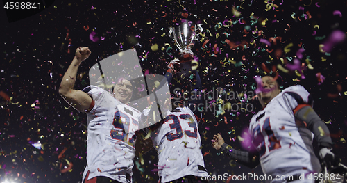 Image of american football team celebrating victory