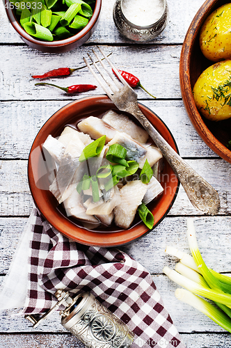 Image of herring with potato