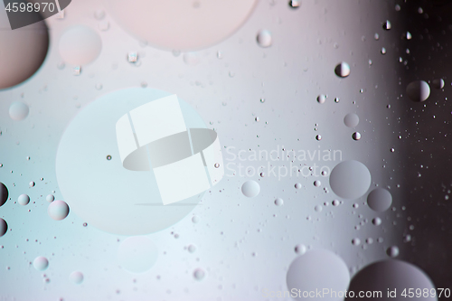 Image of Defocused pastel and dark colored abstract background picture made with oil, water and soap