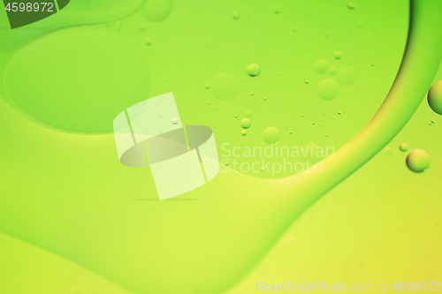 Image of Green and yellow abstract background picture made with oil, water and soap