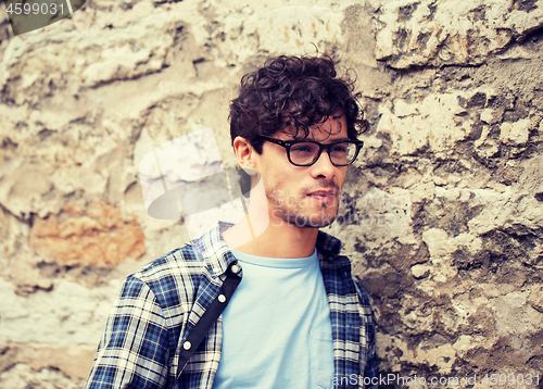 Image of man in eyeglasses on city street