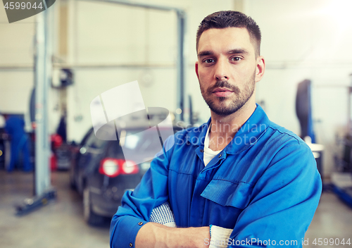 Image of auto mechanic man or smith at car workshop