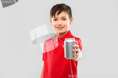 Image of boy in red t-shirt drinking soda from tin can