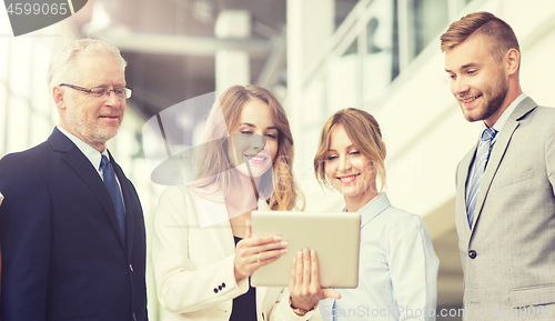 Image of business people with tablet pc computers at office