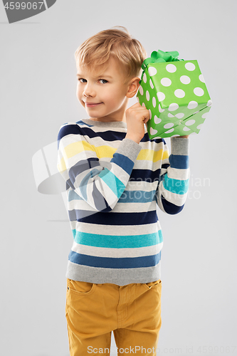 Image of smiling boy with birthday gift box