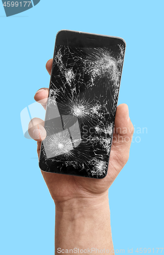 Image of broken phone in the hand