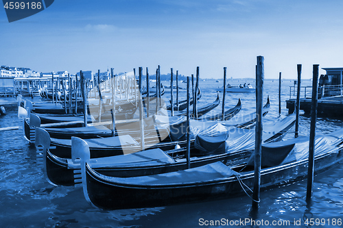 Image of Gondolas moored in front of Saint Mark square in Venice, Italy. 