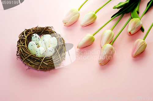 Image of Easter eggs and tulips on wooden planks