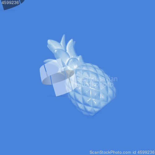 Image of Blue pineapple on a pink background