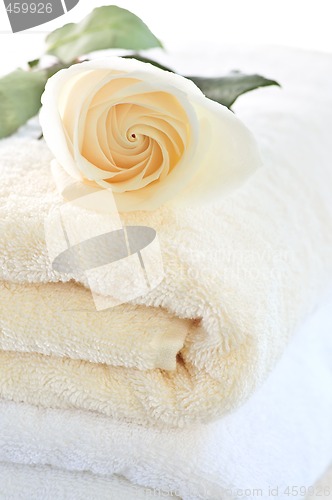 Image of Stack of towels and rose