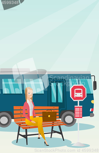 Image of Caucasian woman waiting for a bus at the bus stop.