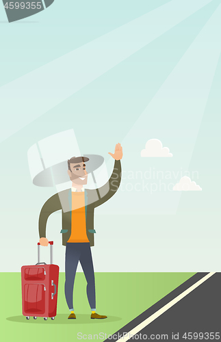 Image of Young caucasian man with suitcase hitchhiking.