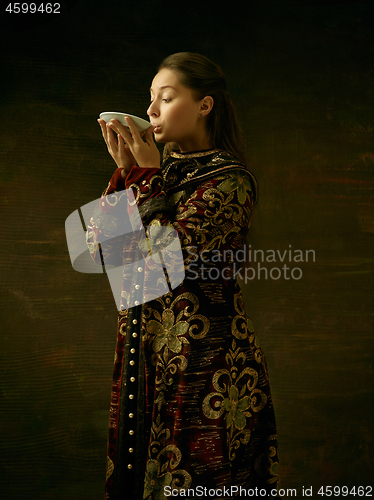 Image of Girl standing in Russian traditional costume.