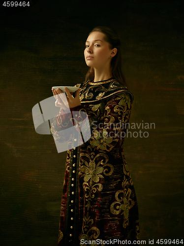 Image of Girl standing in Russian traditional costume.