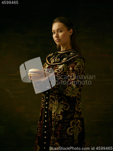 Image of Girl standing in Russian traditional costume.