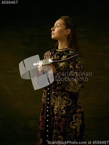 Image of Girl standing in Russian traditional costume.