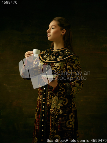 Image of Girl standing in Russian traditional costume.