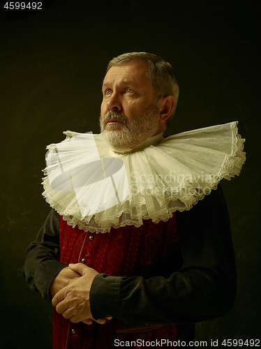 Image of Official portrait of historical governor from the golden age. Studio shot against dark wall.