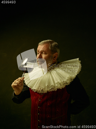 Image of Official portrait of historical governor from the golden age. Studio shot against dark wall.