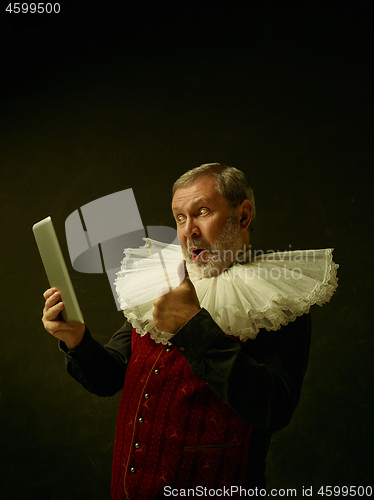 Image of Official portrait of historical governor from the golden age. Studio shot against dark wall.