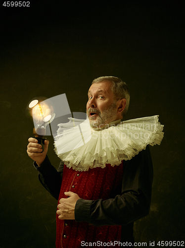 Image of Official portrait of historical governor from the golden age. Studio shot against dark wall.