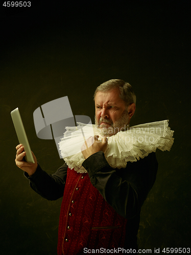 Image of Official portrait of historical governor from the golden age. Studio shot against dark wall.