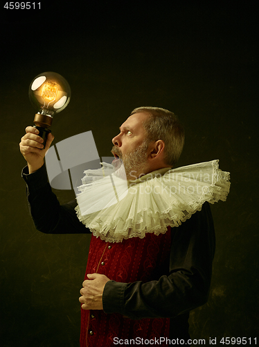 Image of Official portrait of historical governor from the golden age. Studio shot against dark wall.