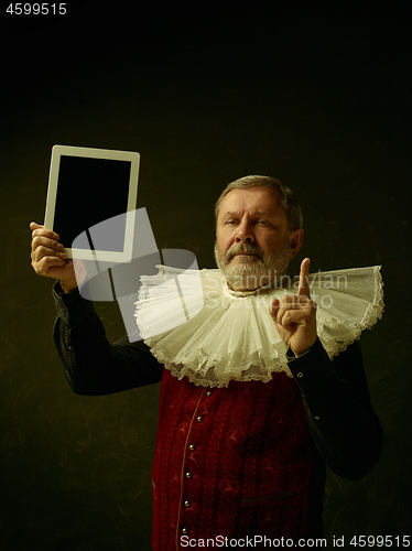 Image of Official portrait of historical governor from the golden age. Studio shot against dark wall.