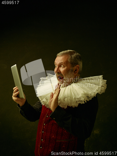 Image of Official portrait of historical governor from the golden age. Studio shot against dark wall.