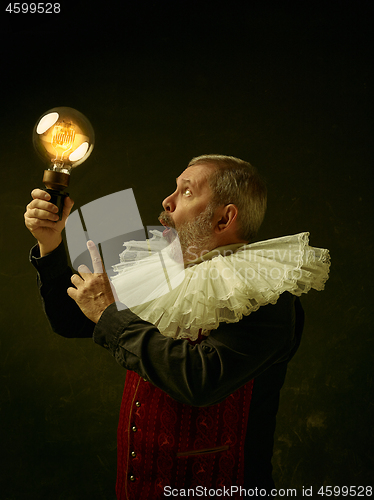 Image of Official portrait of historical governor from the golden age. Studio shot against dark wall.