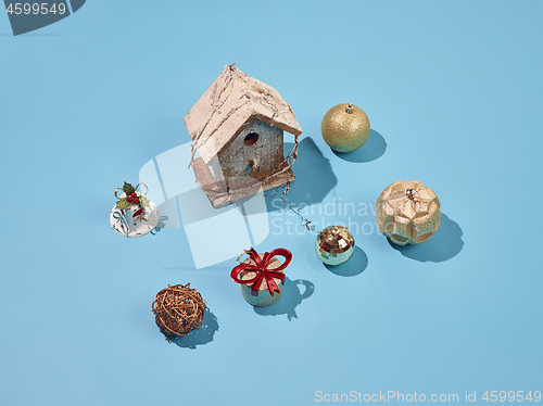 Image of Christmas decoration background over blue background, above view with copy space