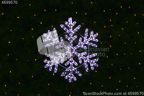 Image of Beautiful christmas decoration, bright glowing snowflake