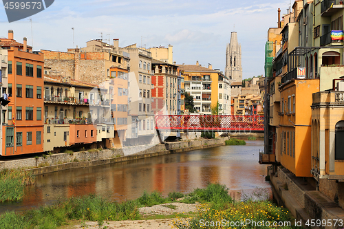 Image of Colorful houses and Eiffel bridge on river Onyar in Girona