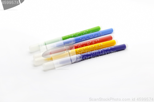 Image of Multicolored markers on white background