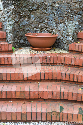 Image of Bricks Stairs and Pot