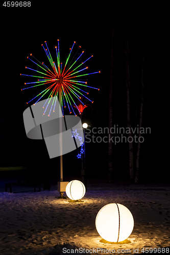 Image of Wonderful holiday illuminated figures decorate night city at winter