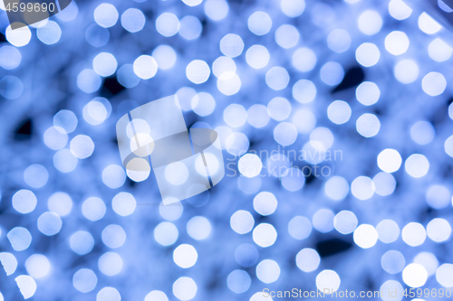 Image of Wonderful holiday illumination of sparkling white and blue bokeh background