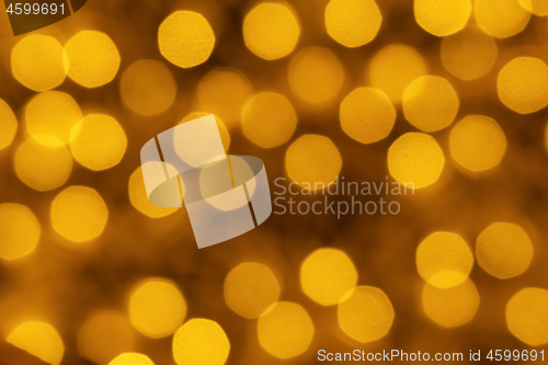 Image of Holiday illumination of sparkling brown and yellow bokeh background