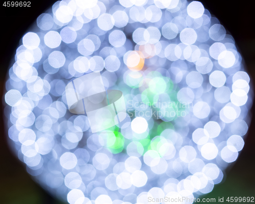 Image of Magic bokeh lights of sparkling holiday illumination at night