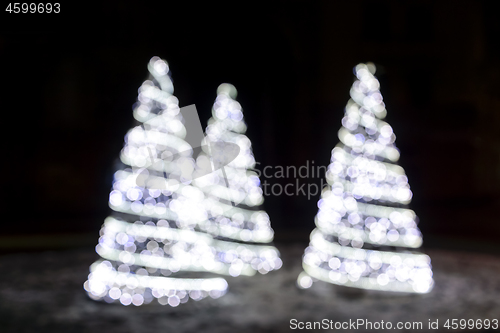 Image of Wonderful holiday fir-tree illumination of sparkling white bokeh background