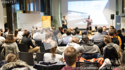 Image of Business speaker giving a talk at business conference event.