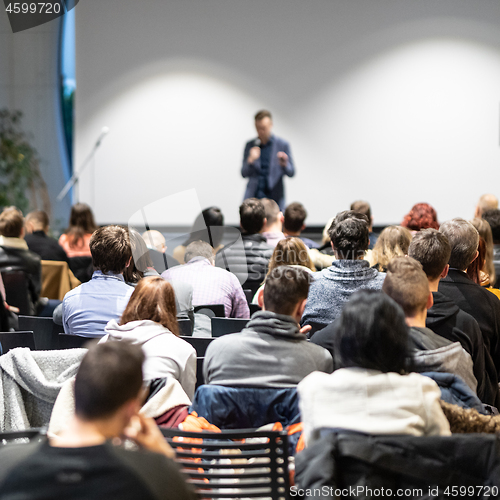 Image of Business speaker giving a talk at business conference event.