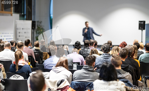 Image of Business speaker giving a talk at business conference event.