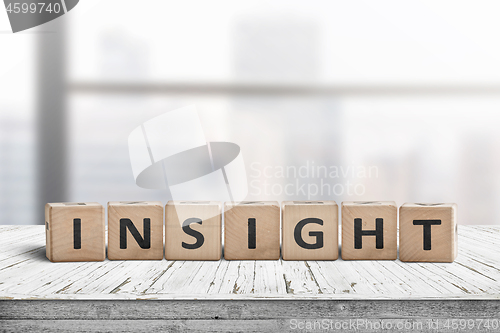 Image of Sign with the word insight in a bright office